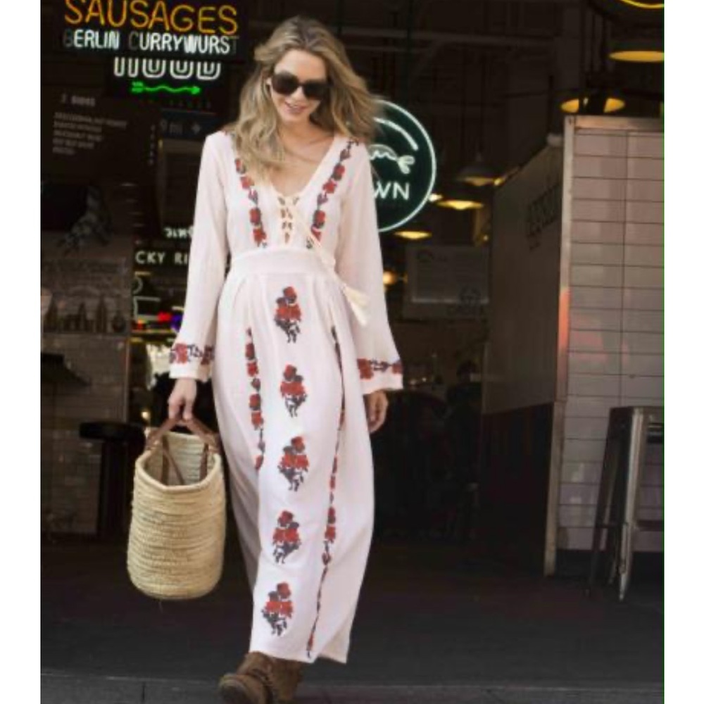 100% cotton dress with brown and orange embroidery.